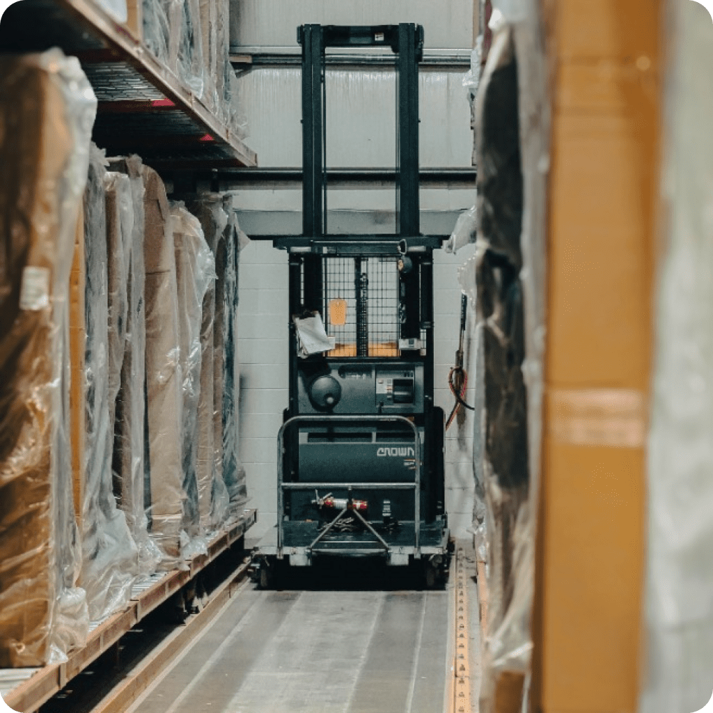 Boxes inside a warehouse with a moving machine
